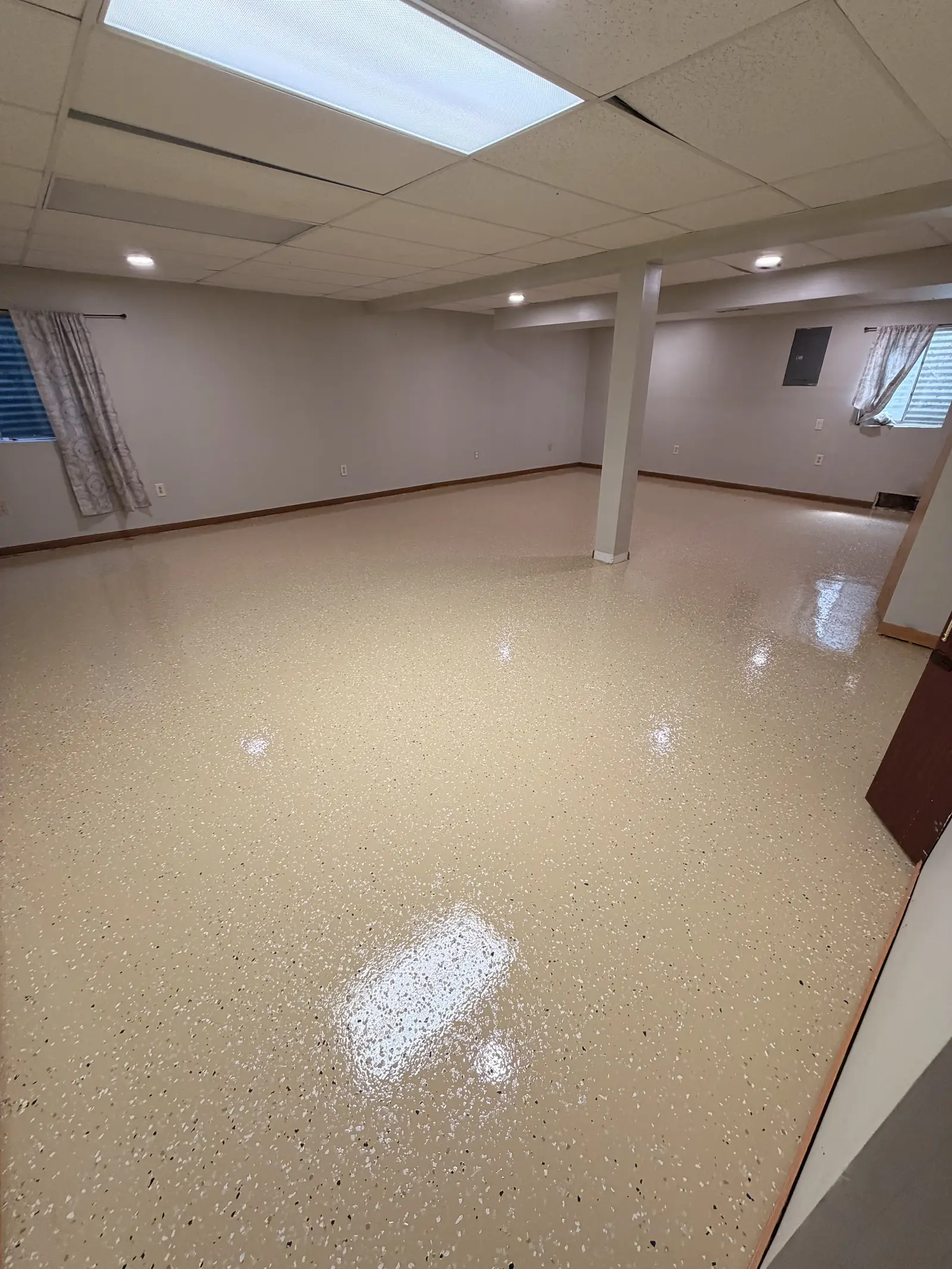Cream quartz floor in a finished basement room